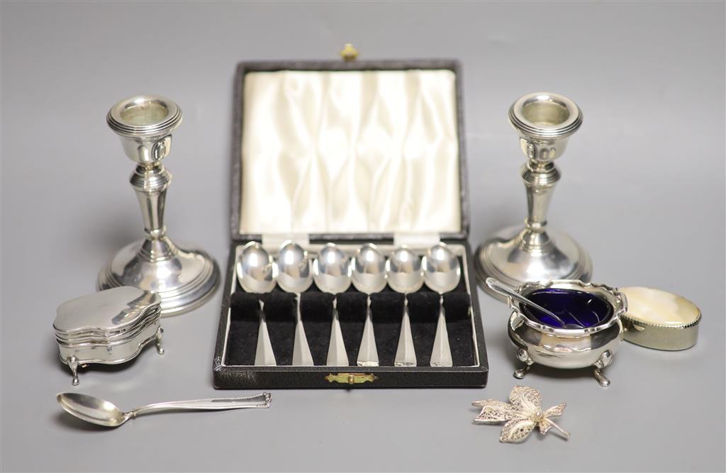 A pair of modern silver dwarf candlesticks, London, 1977, 10.6cm, weighted, two silver condiments, etc.